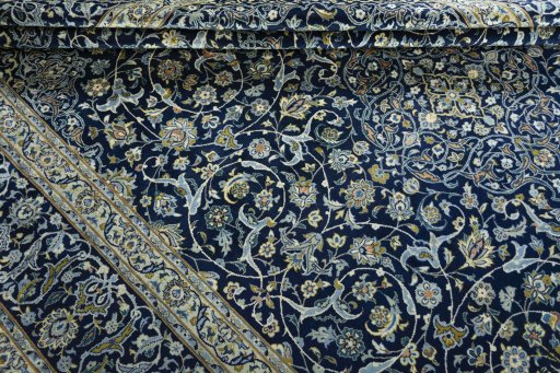 Close-up detail of 2000s Kashan rug from Iran / Persia showing Wool weave
