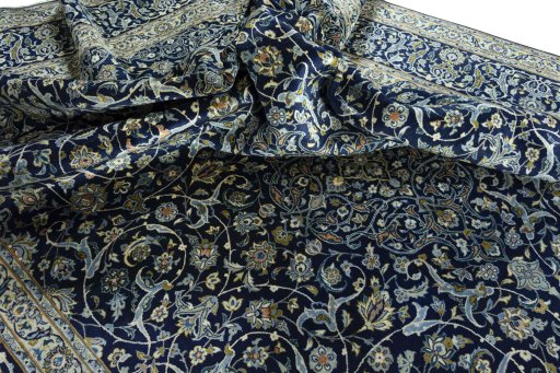 Surface texture of 2000s Kashan rug with natural Wool and intricate pattern