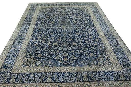 Surface texture of 2000s Kashan rug with natural Wool and intricate pattern