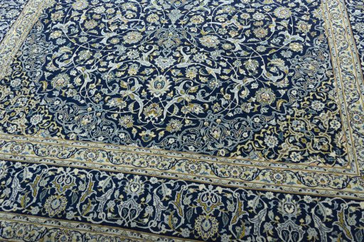 Close-up detail of 2000s Kashan rug from Iran / Persia showing Wool weave