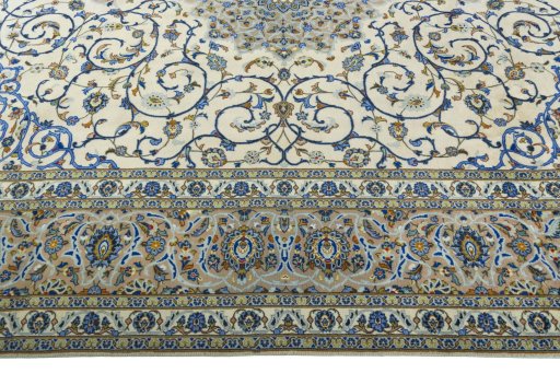 Corner detail of 2000s Kashan rug showing border pattern and Wool pile