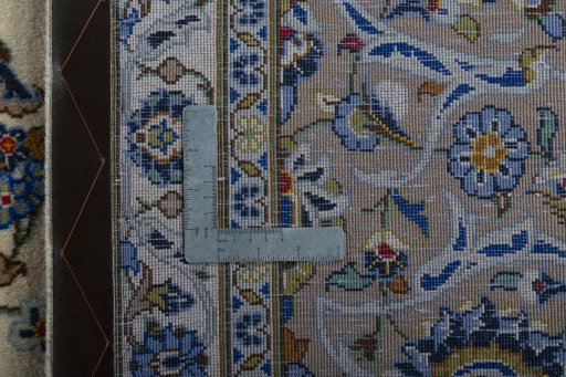 Backside of handmade 2000s Kashan rug showing knot structure and weave density