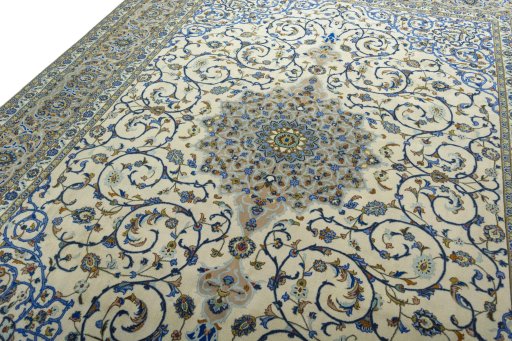Backside of handmade 2000s Kashan rug showing knot structure and weave density