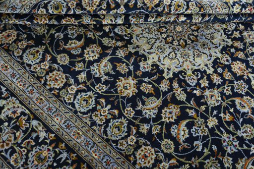 Close-up detail of 2000s Kashan rug from Iran / Persia showing Wool weave