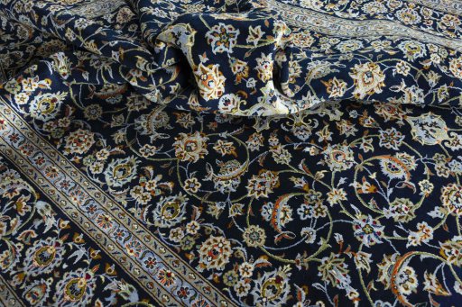 Surface texture of 2000s Kashan rug with natural Wool and intricate pattern
