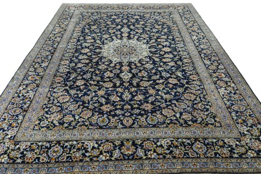 Surface texture of 2000s Kashan rug with natural Wool and intricate pattern