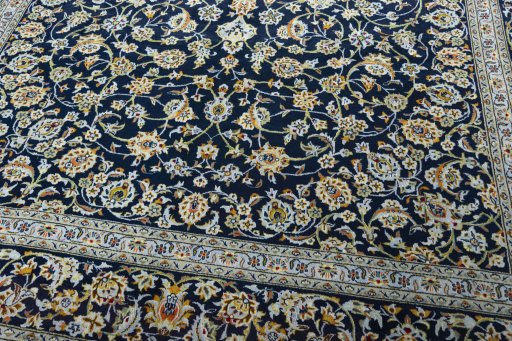 Close-up detail of 2000s Kashan rug from Iran / Persia showing Wool weave