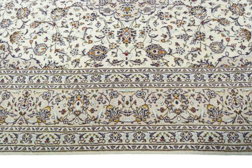 Corner detail of 2000s Kashan rug showing border pattern and Wool pile