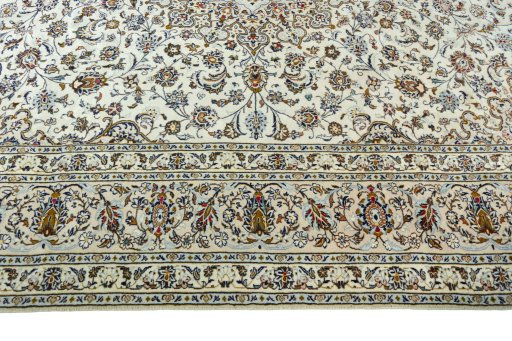 Corner detail of 2000s Kashan rug showing border pattern and Wool pile