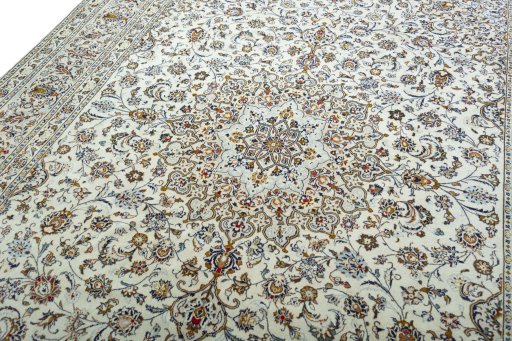 Backside of handmade 2000s Kashan rug showing knot structure and weave density