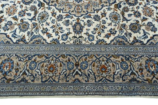 Corner detail of 2000s Kashan rug showing border pattern and Wool pile
