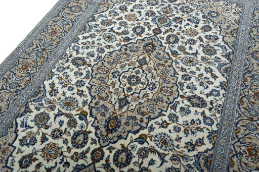 Backside of handmade 2000s Kashan rug showing knot structure and weave density