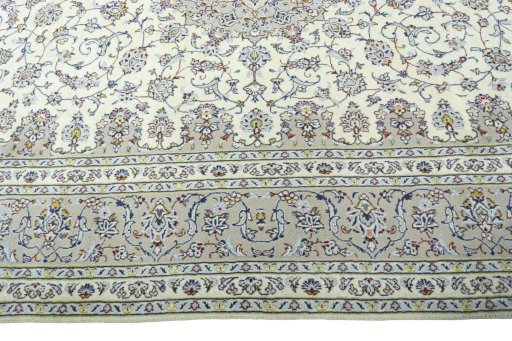 Corner detail of 2000s Kashan rug showing border pattern and Wool pile