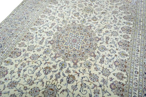 Backside of handmade 2000s Kashan rug showing knot structure and weave density