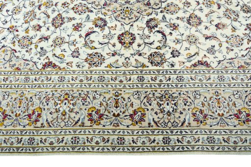 Corner detail of 2000s Kashan rug showing border pattern and Wool pile