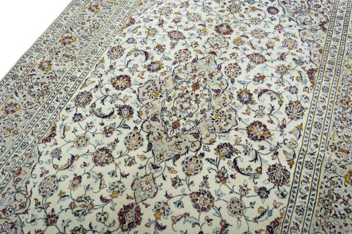 Backside of handmade 2000s Kashan rug showing knot structure and weave density