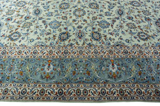 Corner detail of 2000s Kashan rug showing border pattern and Wool pile