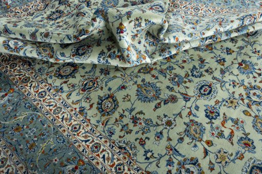 Surface texture of 2000s Kashan rug with natural Wool and intricate pattern