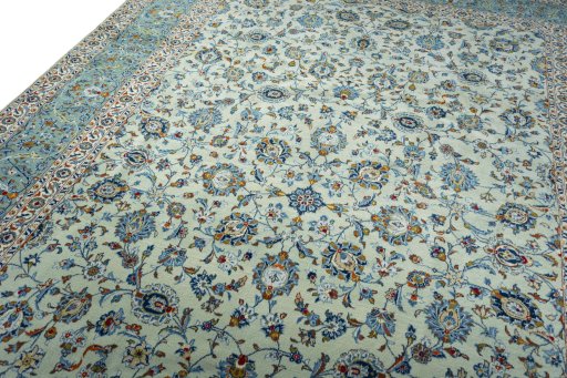 Backside of handmade 2000s Kashan rug showing knot structure and weave density