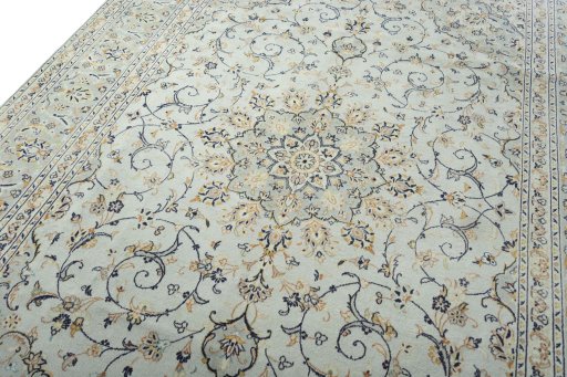 Backside of handmade 2000s Kashan rug showing knot structure and weave density