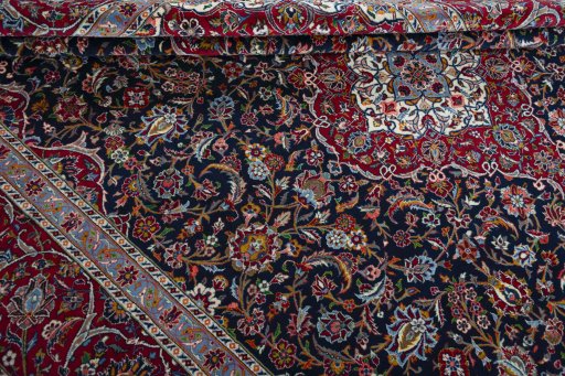 Close-up detail of 2000s Kashan rug from Iran / Persia showing Wool weave