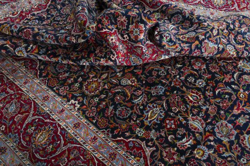 Surface texture of 2000s Kashan rug with natural Wool and intricate pattern