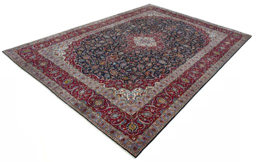 Corner detail of 2000s Kashan rug showing border pattern and Wool pile