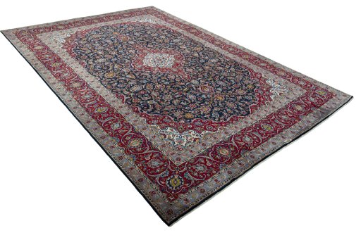 Close-up detail of 2000s Kashan rug from Iran / Persia showing Wool weave