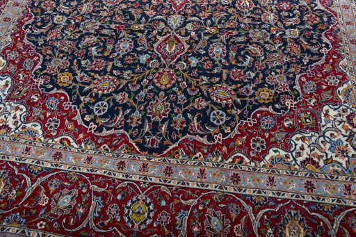Close-up detail of 2000s Kashan rug from Iran / Persia showing Wool weave