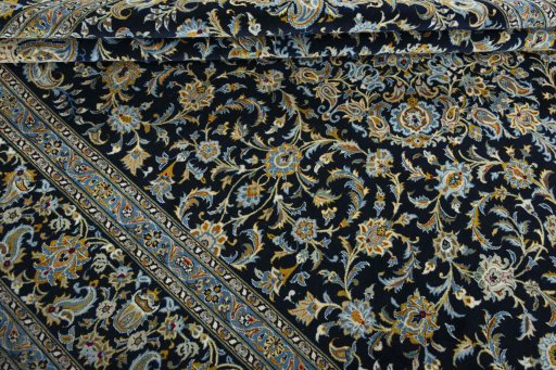 Close-up detail of 2000s Kashan rug from Iran / Persia showing Wool weave
