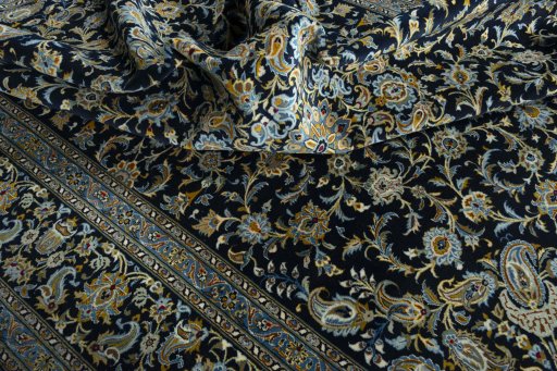 Surface texture of 2000s Kashan rug with natural Wool and intricate pattern