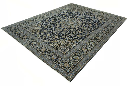 Corner detail of 2000s Kashan rug showing border pattern and Wool pile