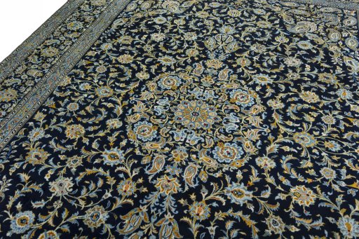 Backside of handmade 2000s Kashan rug showing knot structure and weave density
