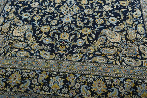 Close-up detail of 2000s Kashan rug from Iran / Persia showing Wool weave