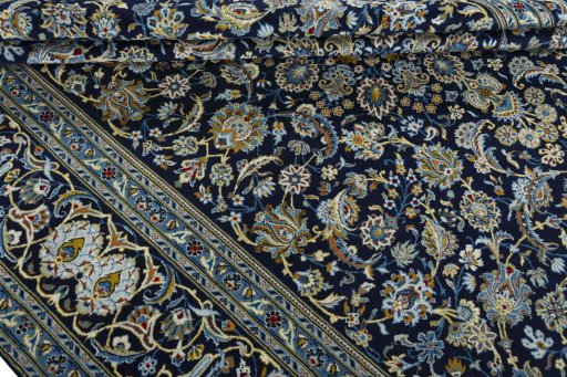 Close-up detail of 2000s Kashan rug from Iran / Persia showing Wool weave
