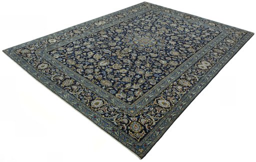 Corner detail of 2000s Kashan rug showing border pattern and Wool pile