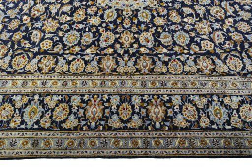 Corner detail of 1970s Kashan rug showing border pattern and Wool pile