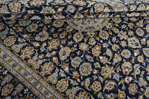 Close-up detail of 1970s Kashan rug from Iran / Persia showing Wool weave