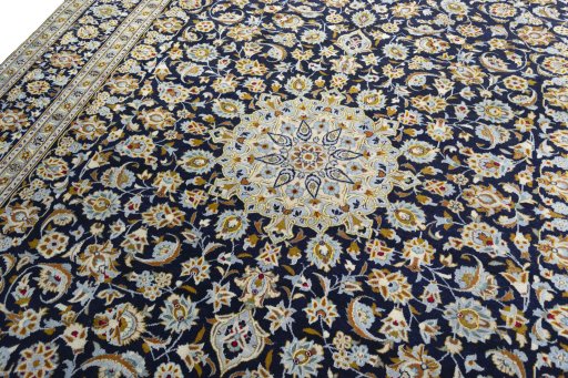 Backside of handmade 1970s Kashan rug showing knot structure and weave density