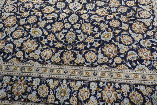 Close-up detail of 1970s Kashan rug from Iran / Persia showing Wool weave
