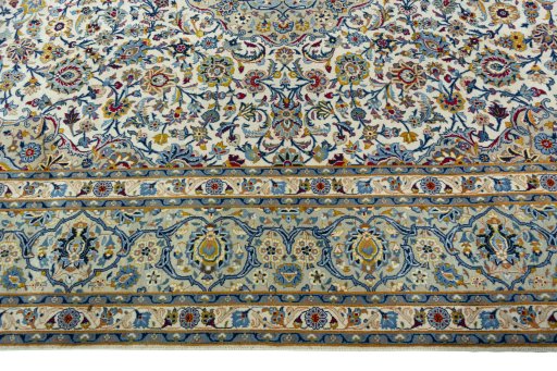 Corner detail of 2000s Kashan rug showing border pattern and Wool pile