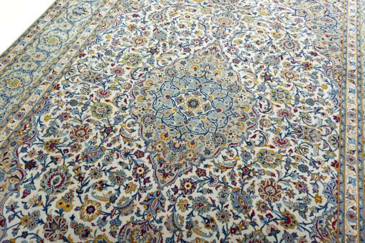 Backside of handmade 2000s Kashan rug showing knot structure and weave density