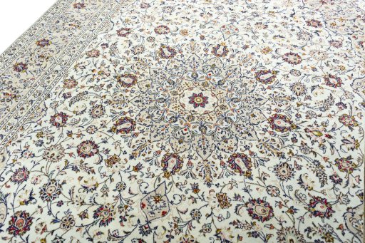 Backside of handmade 2000s Kashan rug showing knot structure and weave density