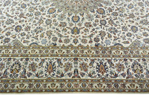 Corner detail of 2000s Kashan rug showing border pattern and Wool pile