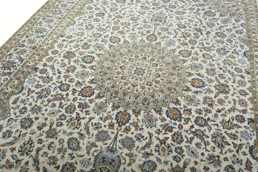 Backside of handmade 2000s Kashan rug showing knot structure and weave density