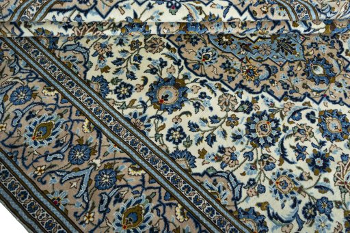 Close-up detail of 2000s Kashan rug from Iran / Persia showing Wool weave