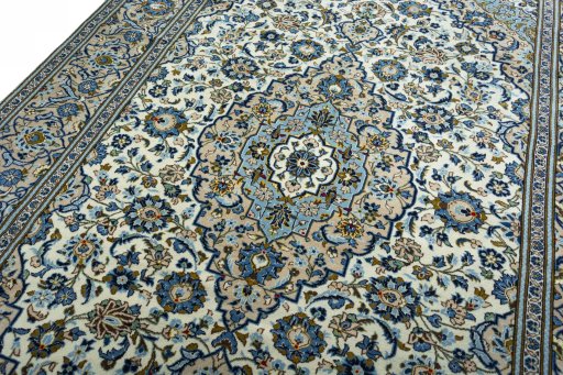 Backside of handmade 2000s Kashan rug showing knot structure and weave density