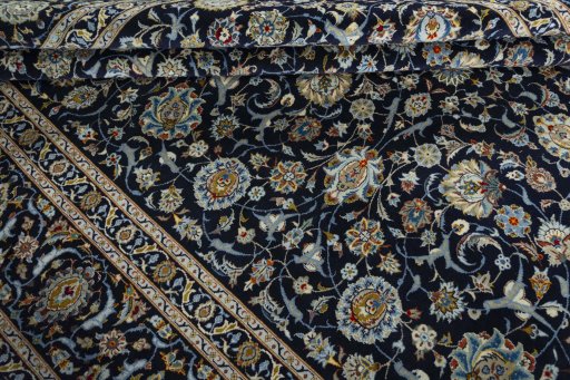 Close-up detail of 2000s Kashan rug from Iran / Persia showing Wool weave