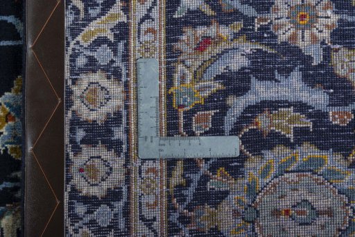 Backside of handmade 2000s Kashan rug showing knot structure and weave density