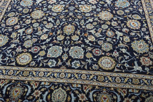Close-up detail of 2000s Kashan rug from Iran / Persia showing Wool weave